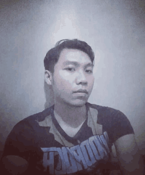 a man wearing a t-shirt that says nobody looks at the camera