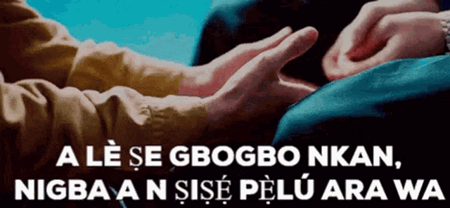 a couple of people holding hands with the words a le se gbogbo nkan
