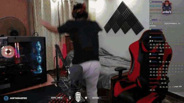 a person is dancing in front of a computer monitor with justabaopro written on the bottom