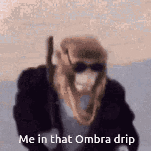 a picture of a man wearing a mask and sunglasses with the caption " me in that ombra drip "
