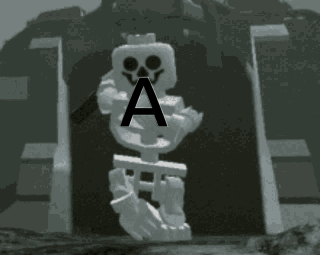 a lego skeleton is holding a stick with the letter a above it