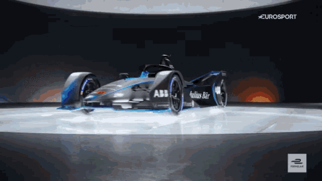 a race car is displayed in front of a eurosport sign