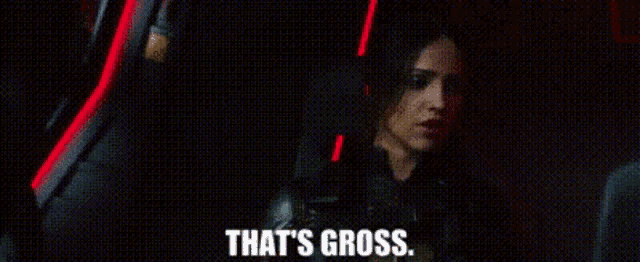 a woman is sitting in a car and saying `` that 's gross . ''