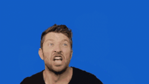 a man is making a funny face with his hands in the air