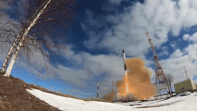 a rocket is being launched in a snowy area