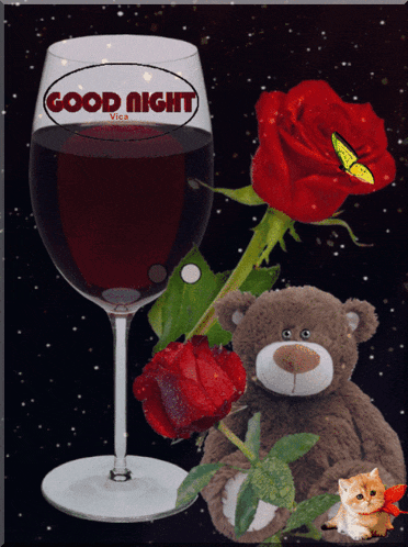 a teddy bear sits next to a glass of wine and a red rose