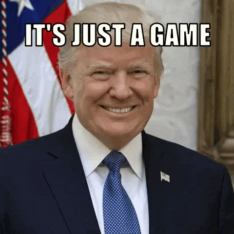 donald trump is smiling in front of the american flag with the caption it 's just a game