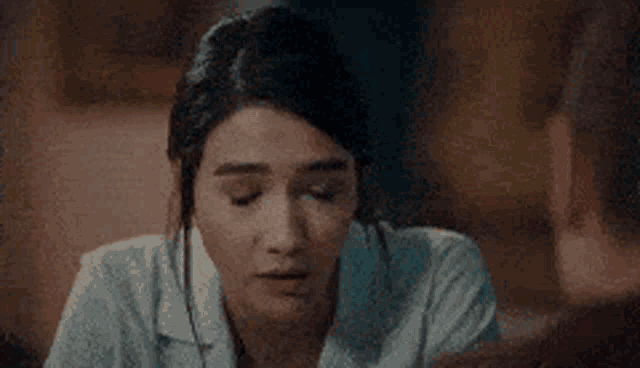 a close up of a woman looking at a man .