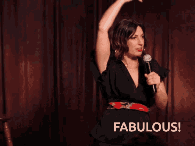a woman singing into a microphone with the words fabulous written below her