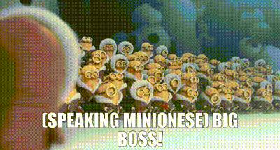a large group of minions are standing next to each other in a row and talking to each other .