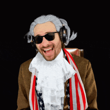 a man in a wig and sunglasses is wearing an american flag scarf
