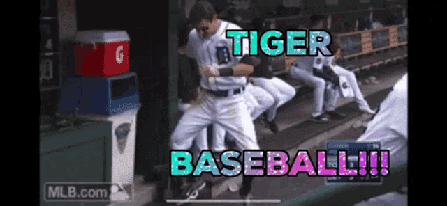 a baseball player is dancing in the dugout with the words " tiger baseball " behind him