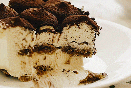 a close up of a piece of cake on a plate with a bite taken out of it