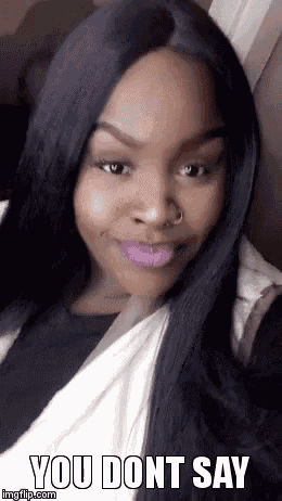 a woman with long black hair and purple lipstick is taking a selfie and says you dont say .