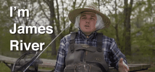 a man in a plaid shirt and overalls is holding a fishing rod and says " i 'm james river "