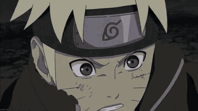 a close up of a cartoon character 's face with the letter g on his headband