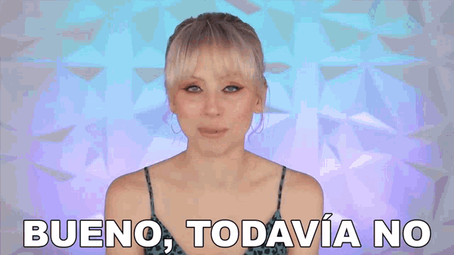 a woman says " falta un poquito " with her hands in the air