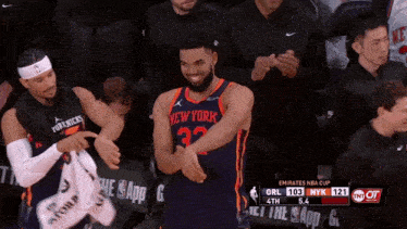 a basketball player for the new york knicks is clapping his hands