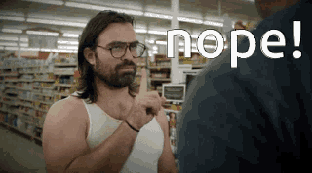 a man wearing glasses and a tank top is pointing at another man with the word nope written above him