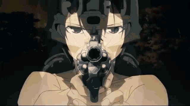 a close up of a person pointing a gun at the camera with the letter r on their face