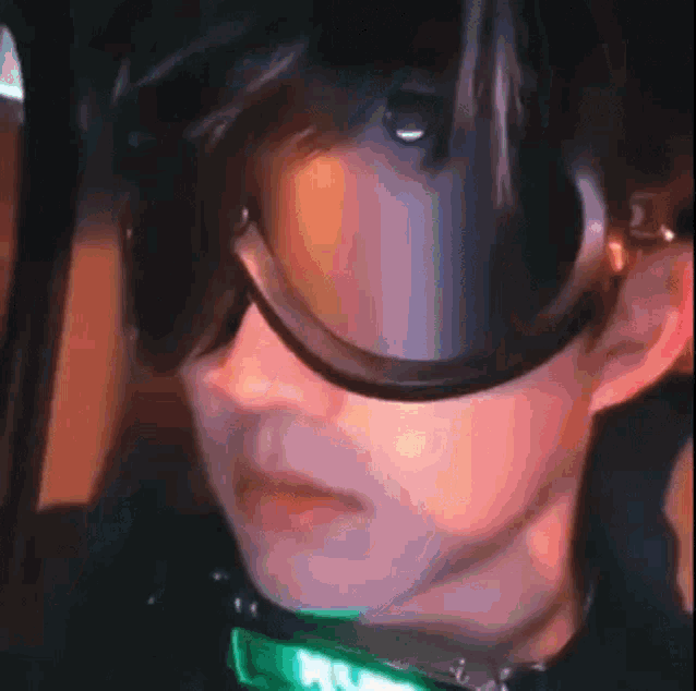 a close up of a person wearing a virtual reality headset and goggles .