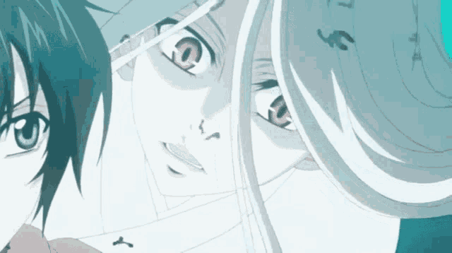 a man and a woman are looking at each other with their eyes closed .