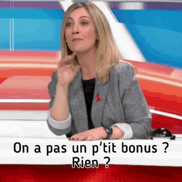 a woman sitting at a table with the words on a pas un p 'tit bonus rien