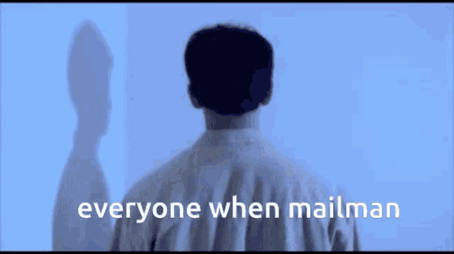 a man is standing in front of a wall with the words everyone when mailman written on the bottom
