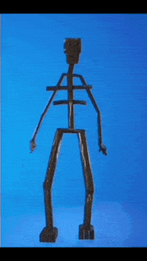 a skeleton made out of sticks is standing on a blue surface