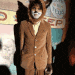 a man in a suit is wearing a fox costume