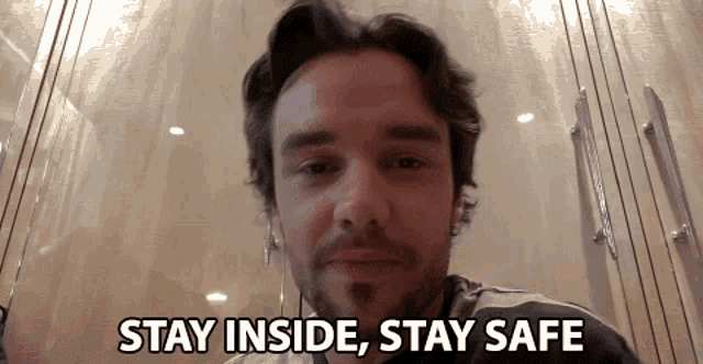 a man says " stay inside stay safe " while looking at the camera
