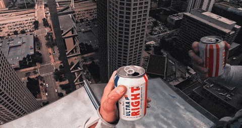 a person is holding a can of bud light