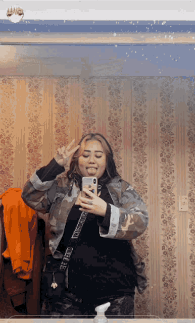 a woman is taking a picture of herself in a mirror with the name p.s. kagoya on the bottom