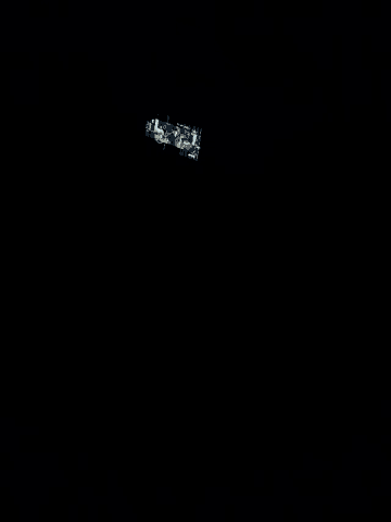a dark room with a light coming out of a window