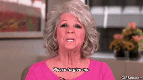 a woman with gray hair and a pink shirt is asking for forgiveness .