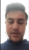 a close up of a man 's face with his eyes closed and his mouth open .