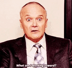 a man in a suit and tie is asking what he is working toward