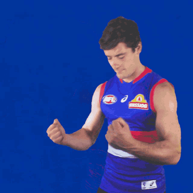 a man wearing a mission jersey holds his fist up