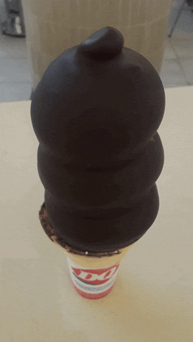 a dairy queen ice cream cone with a chocolate topping