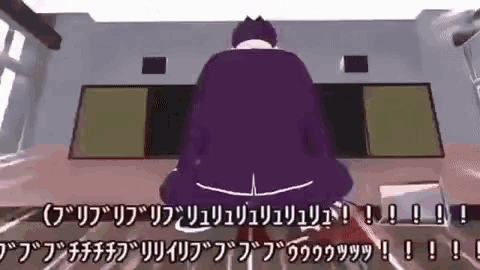 a man in a purple jacket is sitting in front of a screen with chinese writing on it .