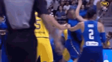 a basketball player in a blue jersey with the number 21 on it