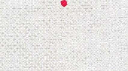 an orange box is sitting on a white surface next to a red box and a yellow box .