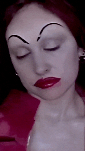 a close up of a woman 's face with red lipstick and white eyebrows