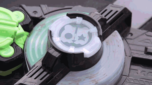 a close up of a toy with a green circle with a star on it
