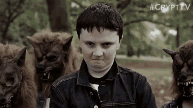 a boy in a denim jacket stands in front of a group of werewolves with #crypttv written on the bottom right