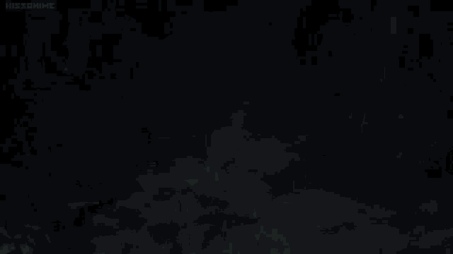 a group of people are standing in the dark with glowing green lights coming out of their eyes .