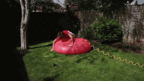 I'Ve Always Wanted To Jump On To A Giant Water Balloon GIF - Waterballoon Slowmotion GIFs