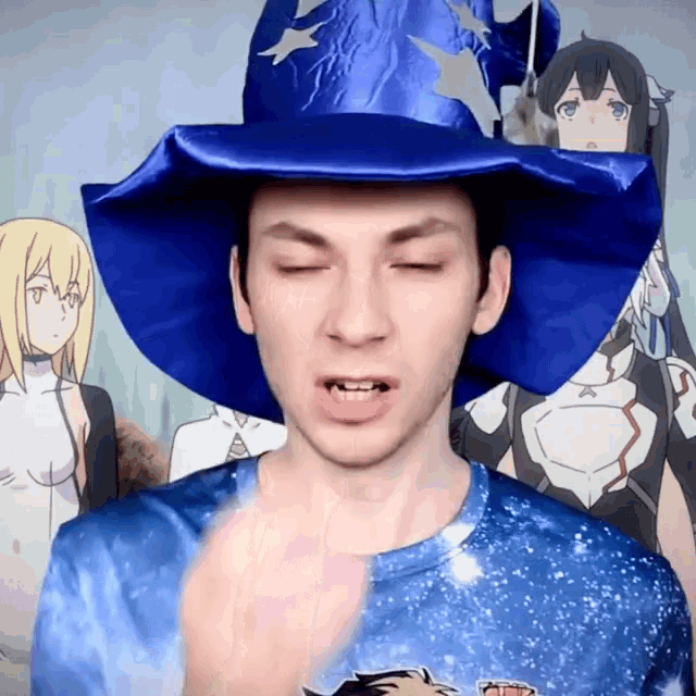 a man wearing a blue wizard hat and a blue shirt is making a funny face