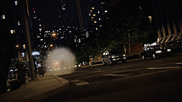 a man in a flash costume is running down a city street