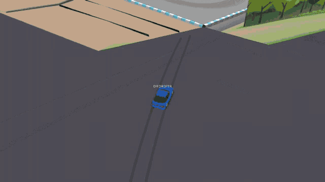 an aerial view of a race track with a blue car going around the corner